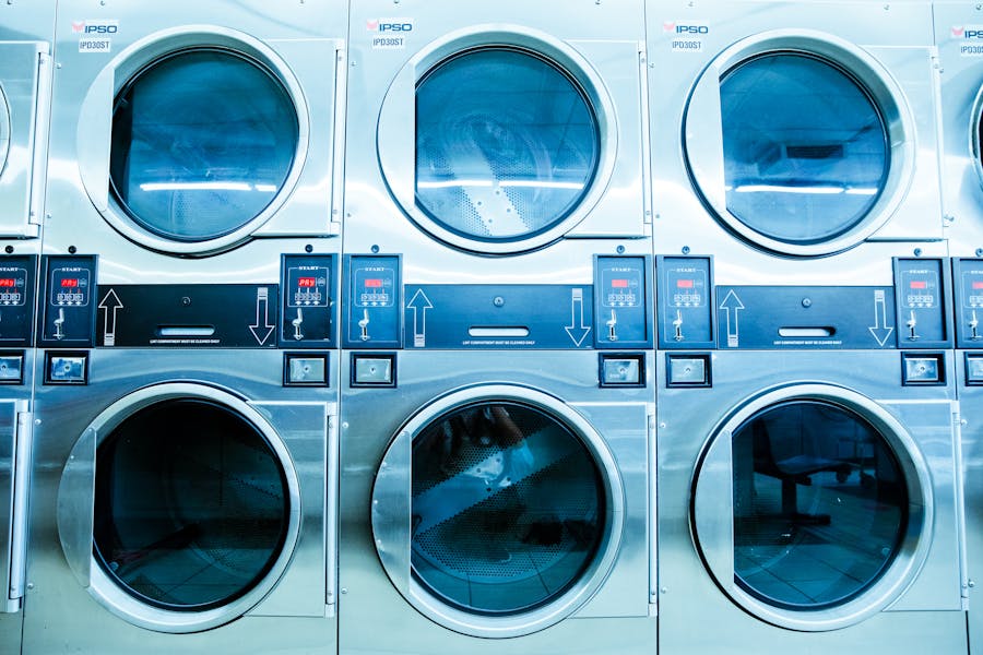 Commercial dryers in a laundromat facility