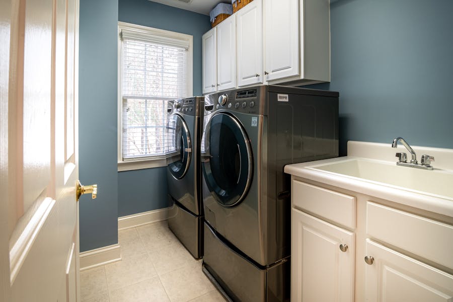 Residential washer and dryer in a home laundry room